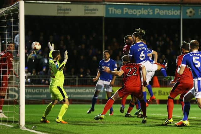 Christian Burgess heads Pompey in front. Picture: Joe Pepler