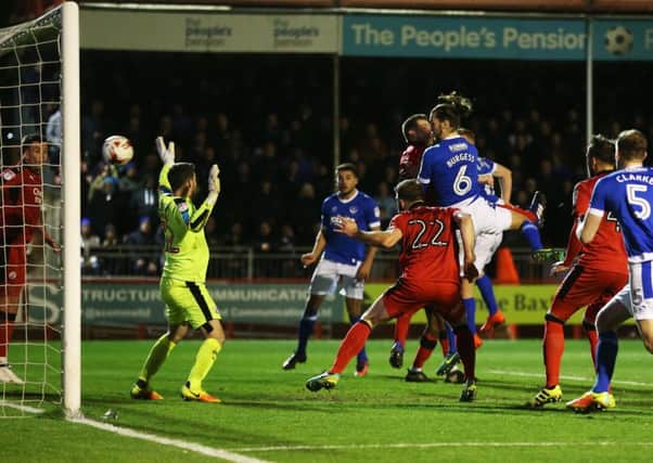 Christian Burgess heads Pompey in front. Picture: Joe Pepler