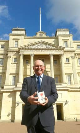 Steve Frampton outside Buckingham Palace after his investiture Picture: Portsmouth College