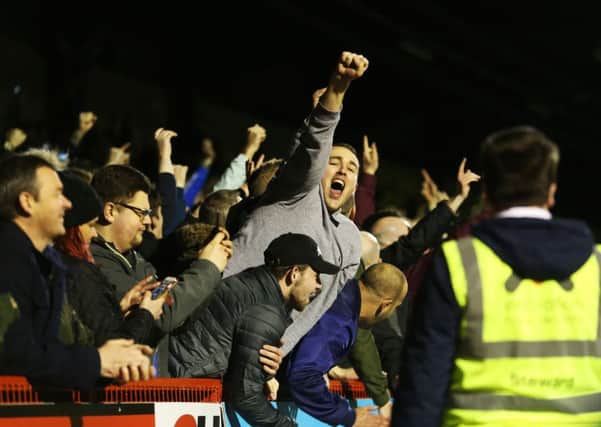 Pompey fans sang their new song at Crawley last night Pic: Joe Pepler