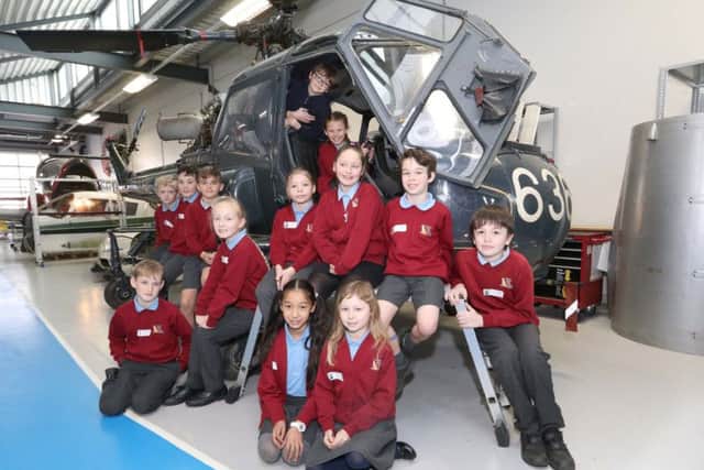 Crofton Anne Dale Junior School pupils learn about aerodynamics on a replica helicopter Picture: Habibur Rahman (170349-60)