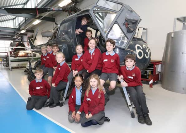 Crofton Anne Dale Junior School pupils learn about aerodynamics on a replica helicopter Picture: Habibur Rahman (170349-60)