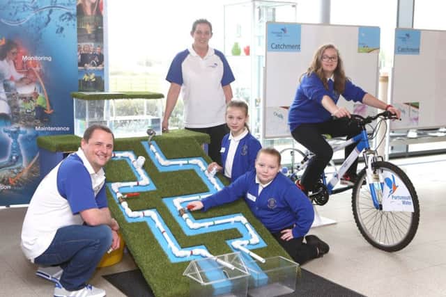 James Bucknall and Frankie Peckham of Portsmouth Water, with pupils from Orchard Lea Junior School learning how water reaches  people's homes. Picture: Habibur Rahman (170349-55)