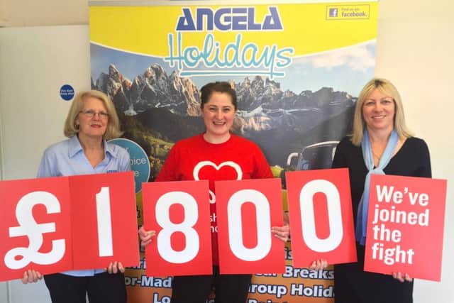 Angela Holidays tour manager Debbie Holbrook, left, and managing director Paula Roe, right, with BHF fundraising manager Gemma Hodgkiss