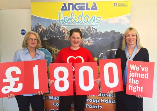 Angela Holidays tour manager Debbie Holbrook, left, and managing director Paula Roe, right, with BHF fundraising manager Gemma Hodgkiss