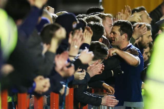 Michael Doyle celebrates Pompey's win against Crawley with the Blues supporters Picture: Joe Pepler
