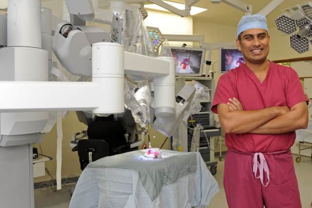 Surgeon Jim Khan with the Da Vinci Robot