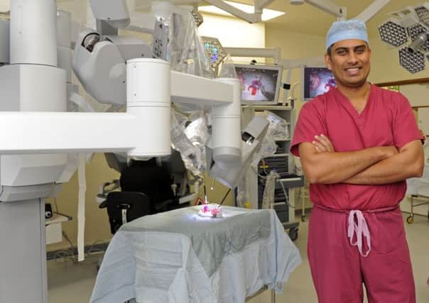 Surgeon Jim Khan with the Da Vinci Robot