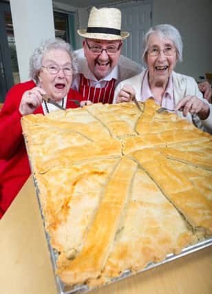 Neil Thompson with residents Pamela Harrison (left) and Pamela Hayer ready to tuck into the pie at Abbeyfield Locks Heath