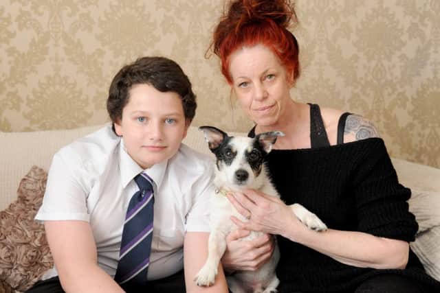 Bex Dann, 45, with her son Logan Dann-Kirby, 14, and their other dog Zorro, a 13-year-old Jack Russell cross Picture: Sarah Standing (170282-3606)