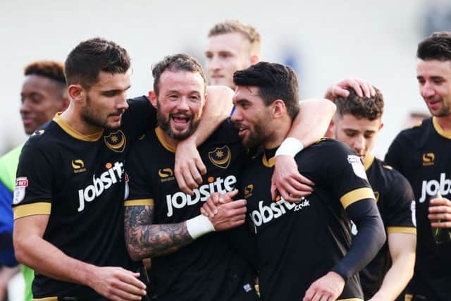 The Pompey players celebrate at the final whistle at the Weston Homes Community Stadium Picture: Joe Pepler