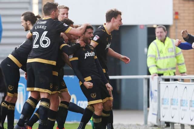Danny Rose, centre, celebrates his goal at Colchester Picture: Joe Pepler
