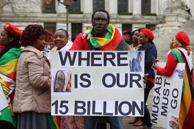 11/3/17
Job 4 : 170354-
CATCH LINE: Demo
Portsmouth Guildhall Square
STORY: Inviting you to cover a Zimbabwean community demonstration highlighting the plight of Zimbabweans as it nears the 2018 elections.
People chanting and dancing outside the Guildhall.
Photography by Habibur Rahman PPP-171103-231553006