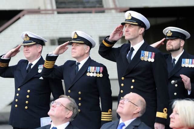 Naval officers salute Picture: Sarah Standing (170383-8281)