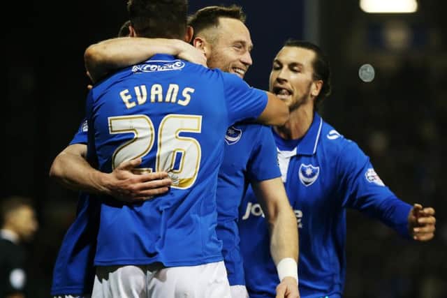 Gareth Evans is congratulated by Ben Davies following his goal against Hartlepool last season