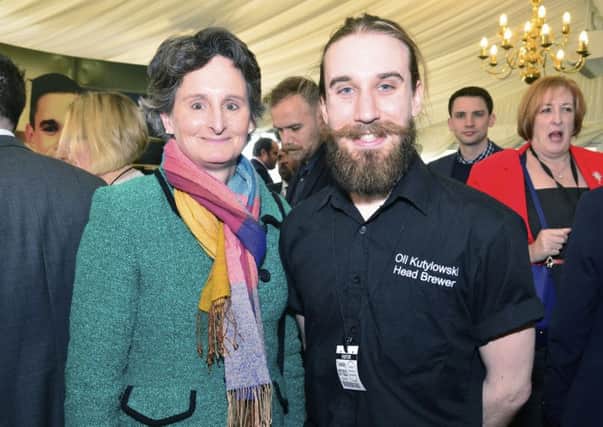 Apprentice Oliver Kutylowski from the Brewhouse & Kitchen and Portsmouth South MP Flick Drummond