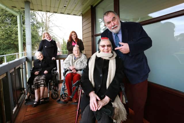 Resident Josie Allman, right, tried on some rugby headgear and is pictured with fellow residents Bunny Storrar and Paul Harvey, home manager Clare Gibson, activities organiser Emily Hudson and Ron Migliorini