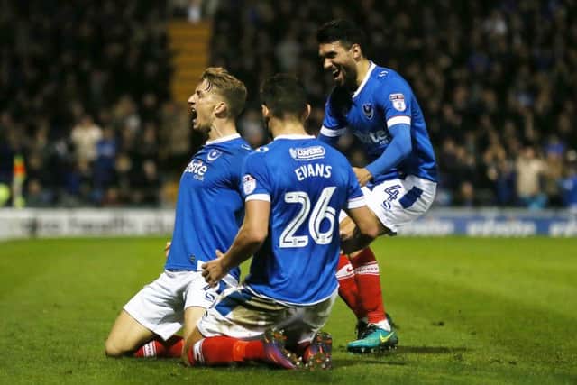 Carl Baker celebrates with his team-mates Gareth Evans and Danny Rose. Picture: Joe Pepler