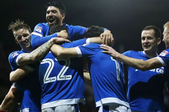 Pompey celebrate Kal Naismith's goal against Grimsby. Picture: Joe Pepler