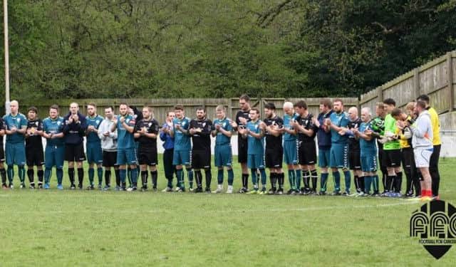 Last years teams gather for a moment of reflection