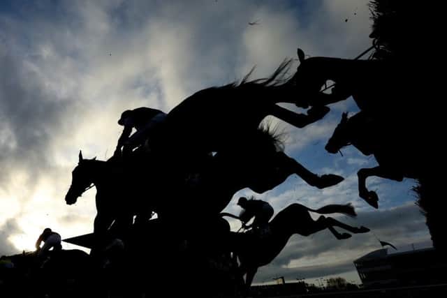 Runners and riders compete in the 16:50 JT McNamara National Hunt Challenge Cup Amateur Riders' Novice Chase during Champion Day of the 2017 Cheltenham Festival at Cheltenham Racecourse. Photo credit should read: David Davies/PA Wire. PPP-170315-121919001
