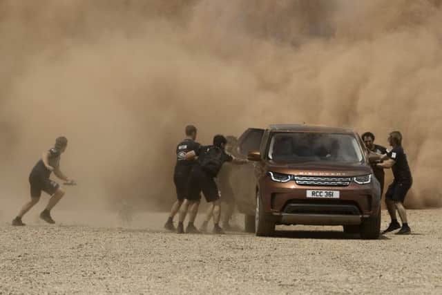 A still from the TV ad for the Land Rover Discovery starring Sir Ben Ainslie and the Land Rover BAR sailing team  Picture: Land Rover UK