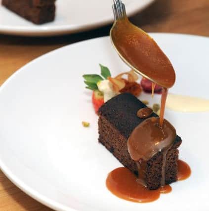 A dessert of sticky toffee pudding with butterscotch sauce, stem ginger ice cream, tuile biscuit, pistachio crumb, prepared by chef Michael Findlay working for La Belle Assiette.Picture: Sarah Standing (170263-7319)