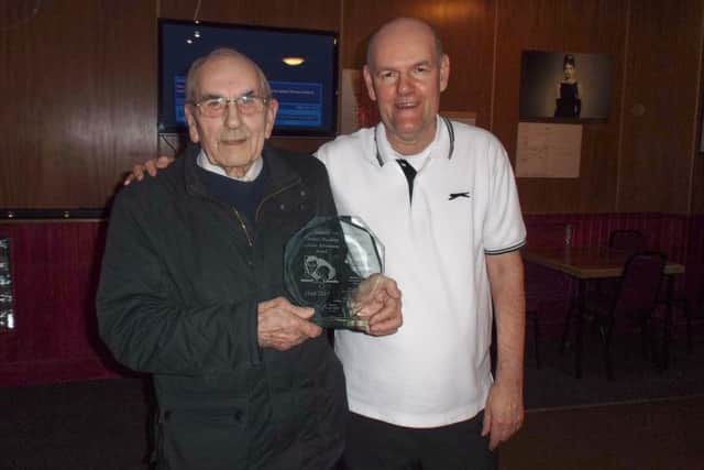 Dennis Hushley, left, receives his award