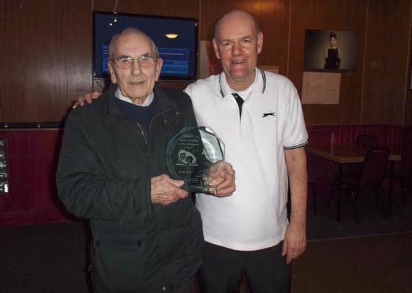 Dennis Hushley, left, receives his award