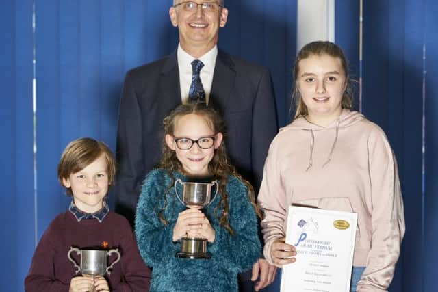 From left, Monty Johnson, Berry Johnson and Eleanor Palmer with their awards from the event