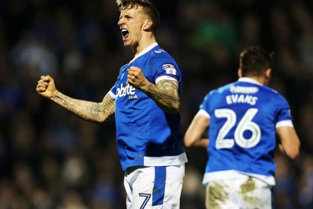 Carl Baker celebrates his goal in Pompey's 4-0 win against Grimsby at Fratton Park on Tuesday night Picture: Joe Pepler