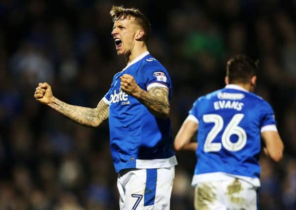 Carl Baker celebrates his goal in Pompey's 4-0 win against Grimsby at Fratton Park on Tuesday night Picture: Joe Pepler