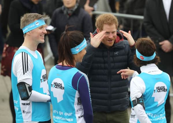 Leane Stevenson, right, meets Prince Harry at the Heads Together London Marathon training day at the Quayside in Gateshead, Newcastle. Picture: Owen Humphreys/PA Wire.