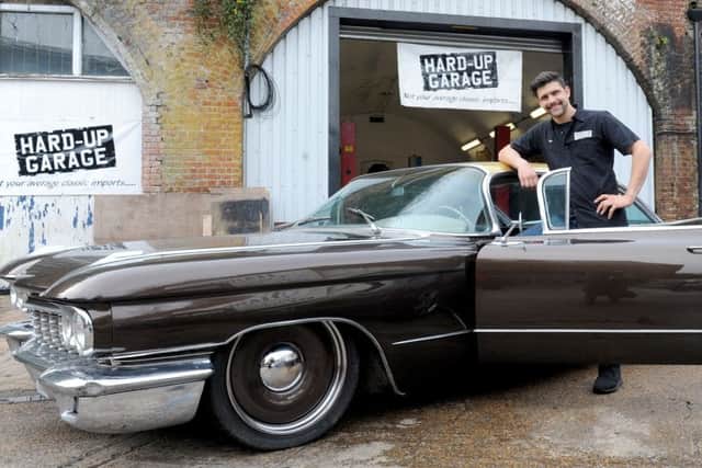 Sam Hard with a restored Cadillac