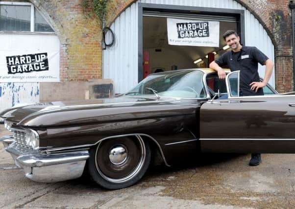 Sam Hard with a restored Cadillac