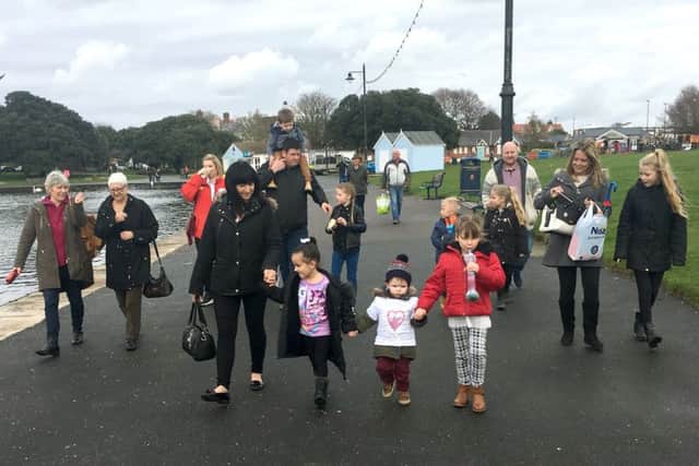 Brinley Macdonald with friends and family walking around Canoe Lake