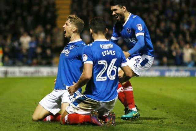 Gareth Evans rushes to Carl Baker to celebrate the winger's goal against Grimsby Picture: Joe Pepler