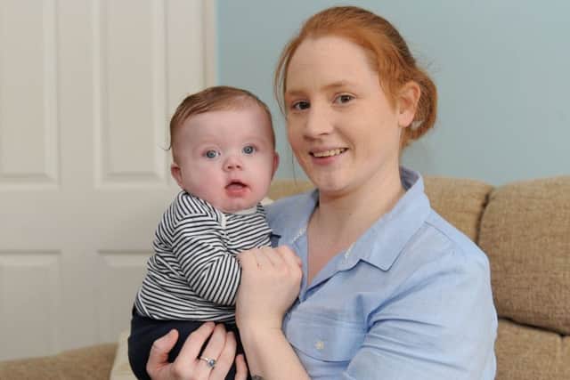 Sarah Edwards, 28, from Fareham, who is holding a fun day fundraising event at Wymering Methodist Church Hall in Cosham on April 2, with her son Ernie Picture: Sarah Standing (170394-4289)