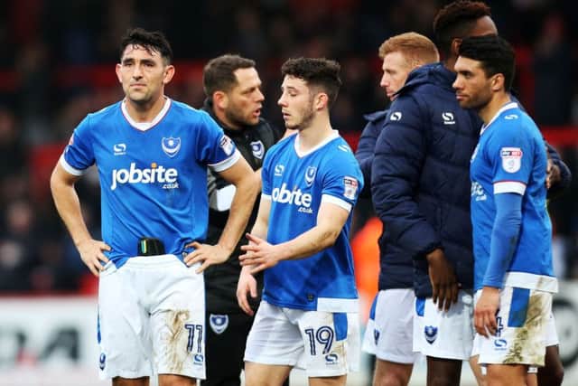 Pompey players dejected after the final whistle at Stevenage. Picture: Joe Pepler