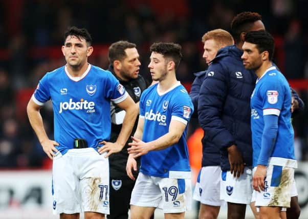 Pompey players dejected after the final whistle at Stevenage. Picture: Joe Pepler