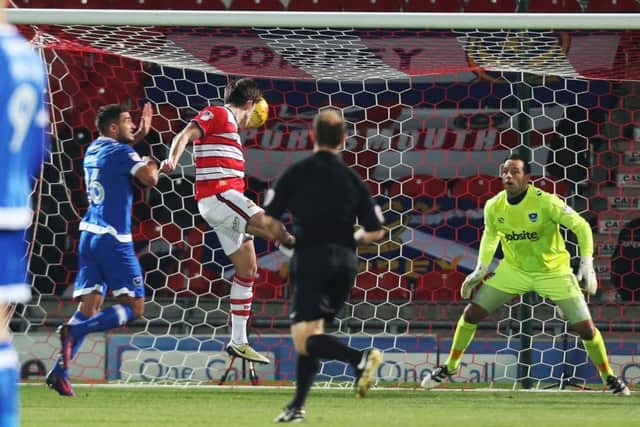 DONCASTER, UK, 5TH JANUARY, 2017. Doncaster's John Marquis scores his first goal of the match during the Sky Bet League 2 match between Doncaster Rovers and Portsmouth at the Keepmoat Stadium, Doncaster, England on 5 January 2017. Photo by Joe Pepler/Digital South. PPP-170501-200138006