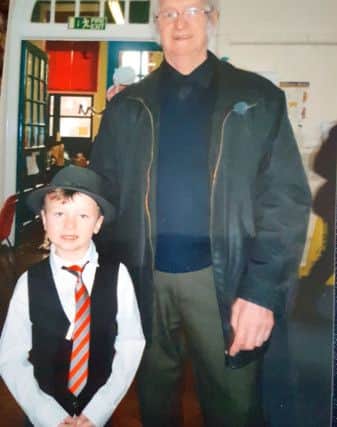 An old photo of Alfie, left, and his grandfather, Gerald