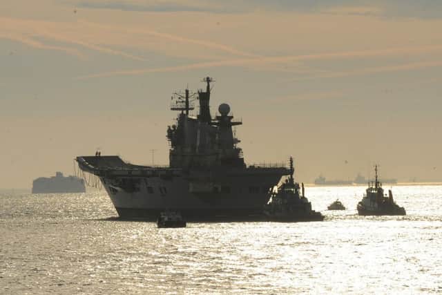 The former HMS Illustrious leaving Portsmouth for the final time on a voyage to be scrapped in Turkey