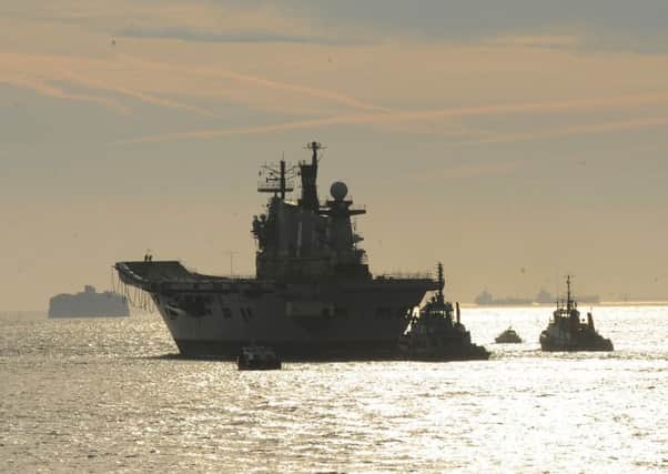 The former HMS Illustrious leaving Portsmouth for the final time on a voyage to be scrapped in Turkey