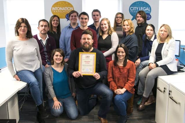 Intonations commercial director Dan Peachey with ATC certificate and the project management team