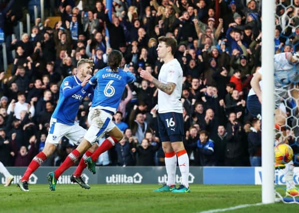 Christian Burgess celebrates his goal in Pompey's win against Luton in January. Picture: Joe Pepler