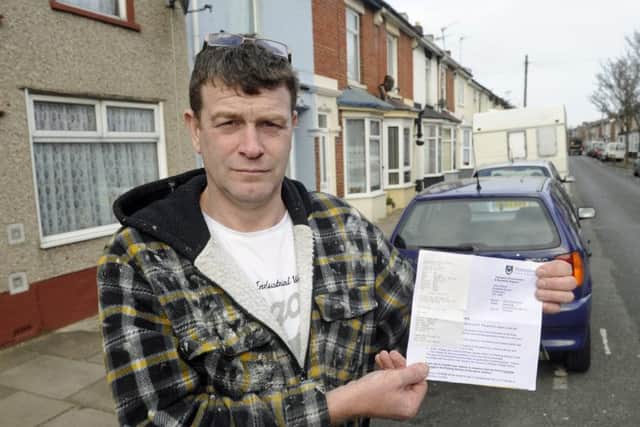 Painter and decorator Michael Brown who is angry with Portsmouth City Council for raising the second car parking charge in Lower Derby Road. Photo: Ian Hargreaves (170327-1) PPP-170317-091628006