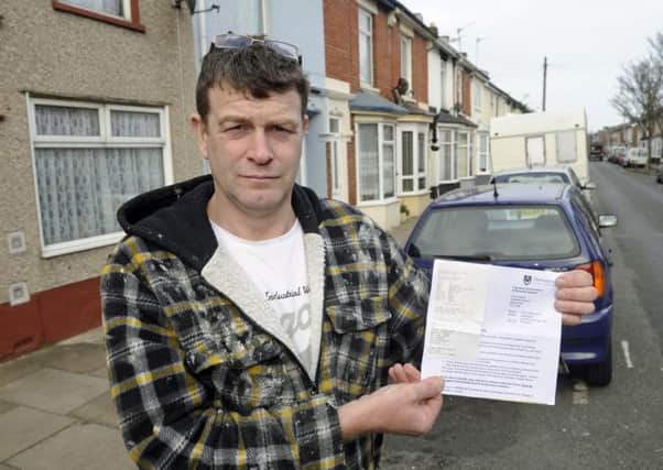 Painter and decorator Michael Brown who is angry with Portsmouth City Council for raising the second car parking charge in Lower Derby Road. Photo: Ian Hargreaves (170327-1) PPP-170317-091628006