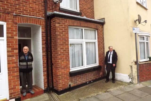 David  Yates, right, outside 23, Garnier Street, Fratton. The original  front room of the  house is where he is  standing.