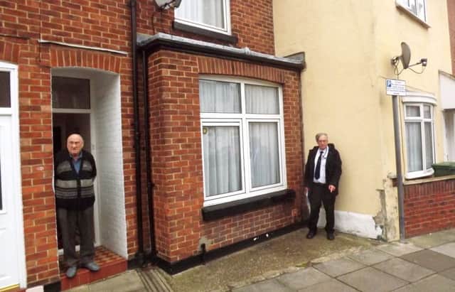 David  Yates, right, outside 23, Garnier Street, Fratton. The original  front room of the  house is where he is  standing.